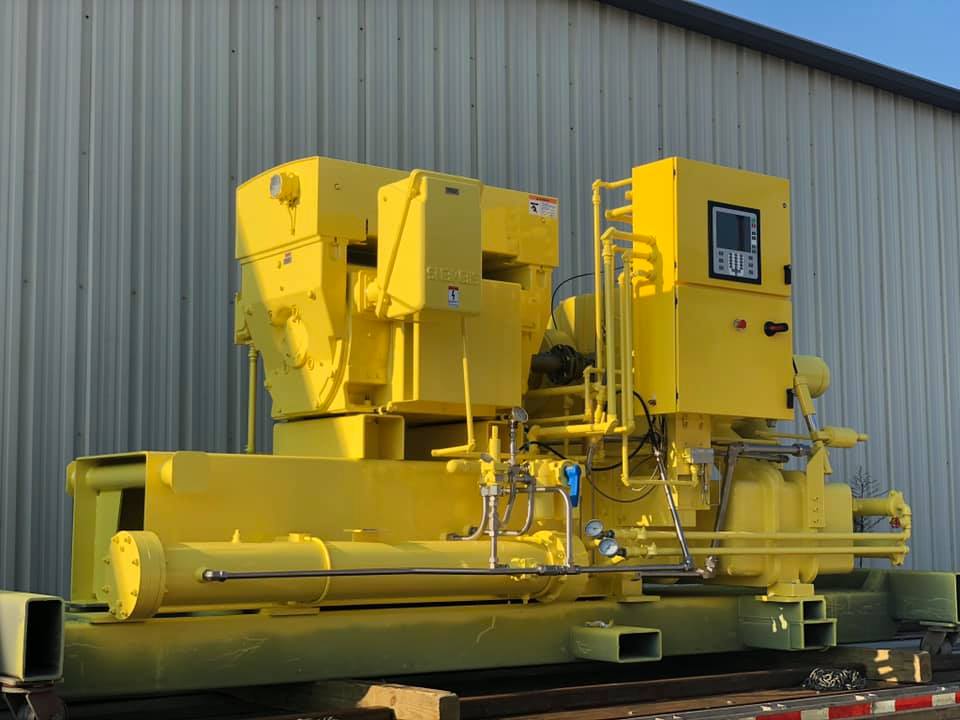 Yellow-painted industrial equipment outside Carolina Finishing’s shop