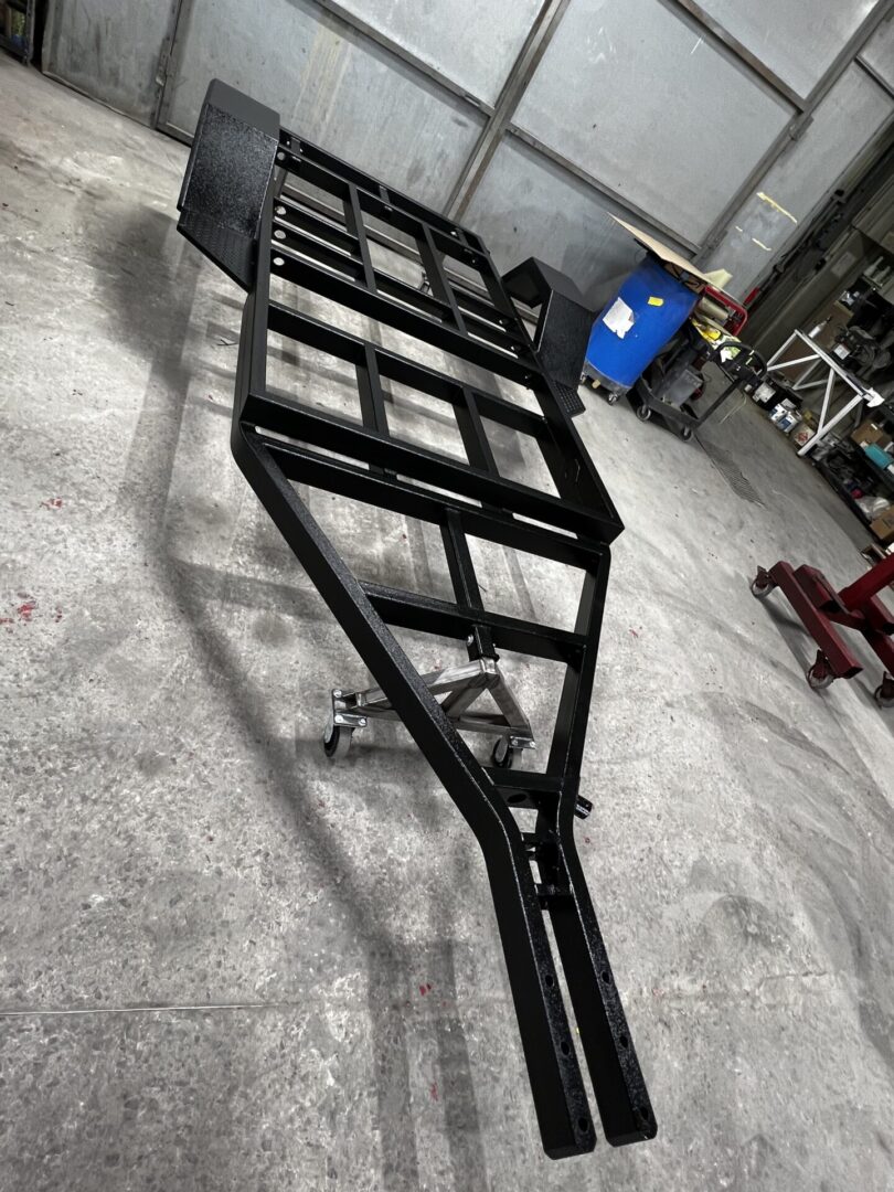 Black paint coating for a vehicle trailer