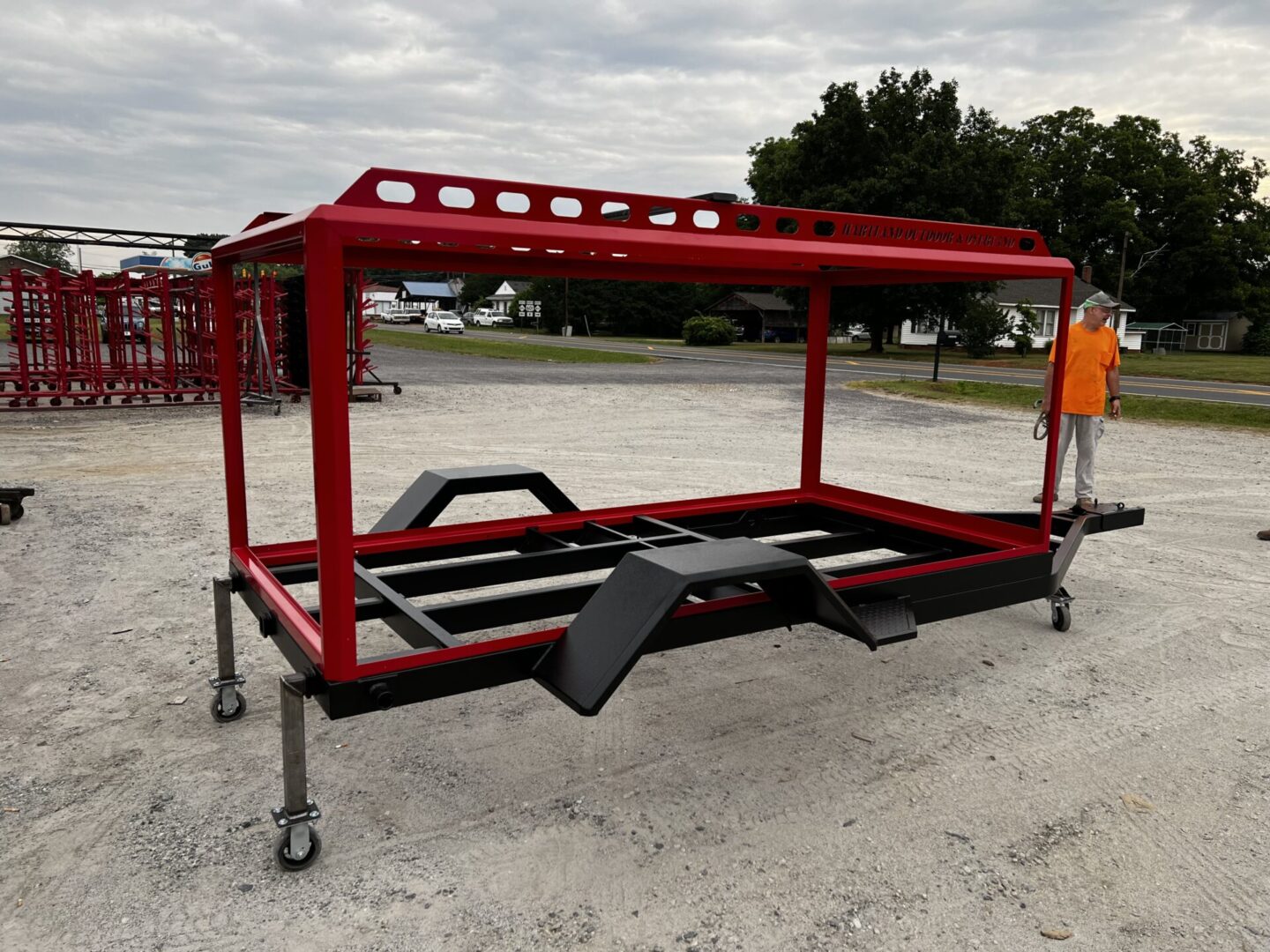 A frame of a red vehicle trailer